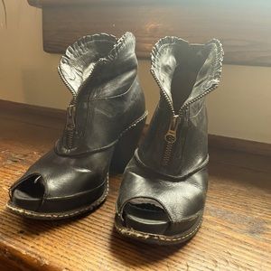 Size 7.5 B. Black cowgirl booties with zipper and leather ruffle